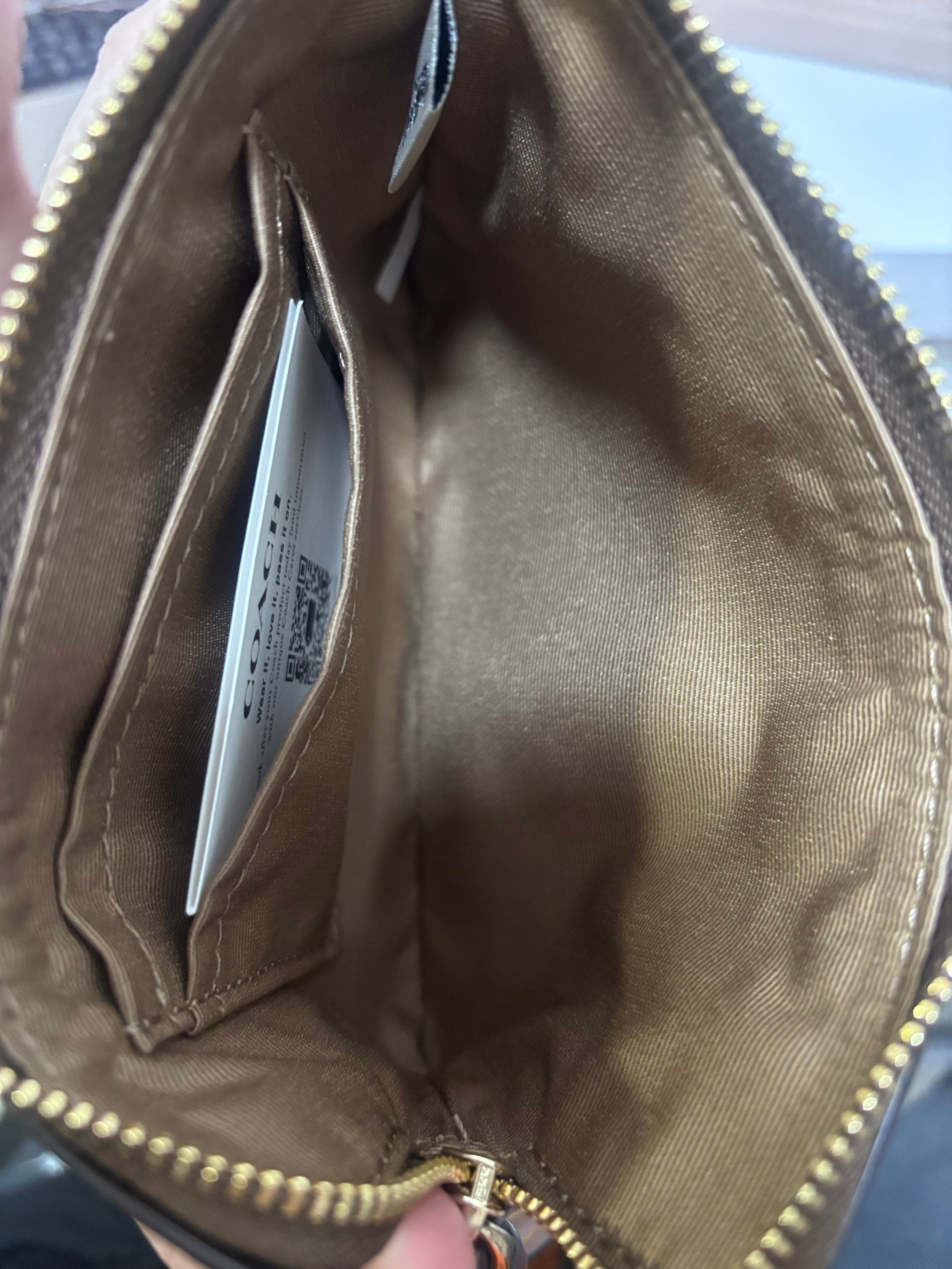 COACH Corner Zip Wristlet In Signature Canvas With Stripe