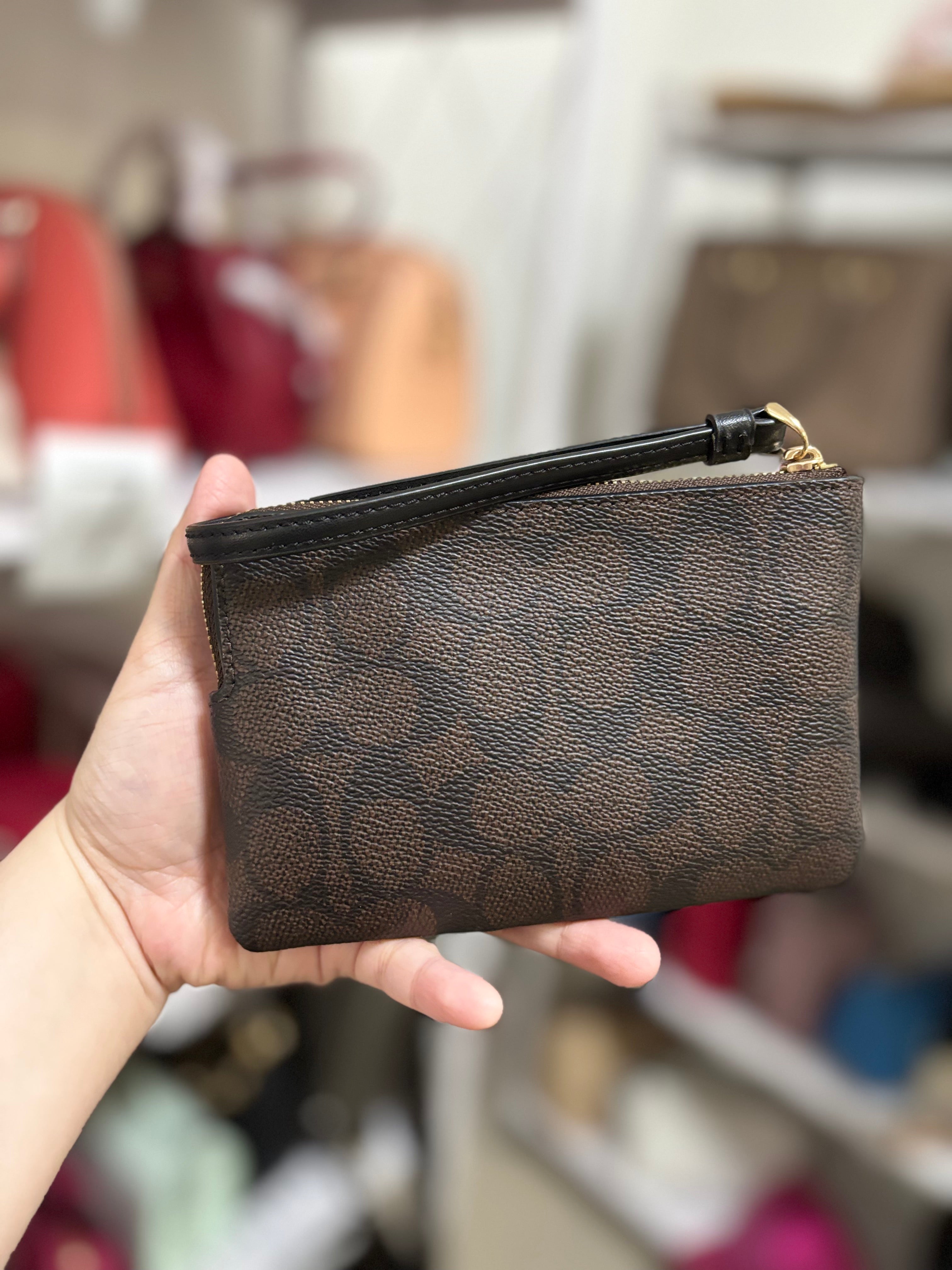 COACH Corner Zip Wristlet in Signature Canvas