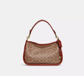 COACH Cary Crossbody Bag In Signature Canvas - Tan Rust