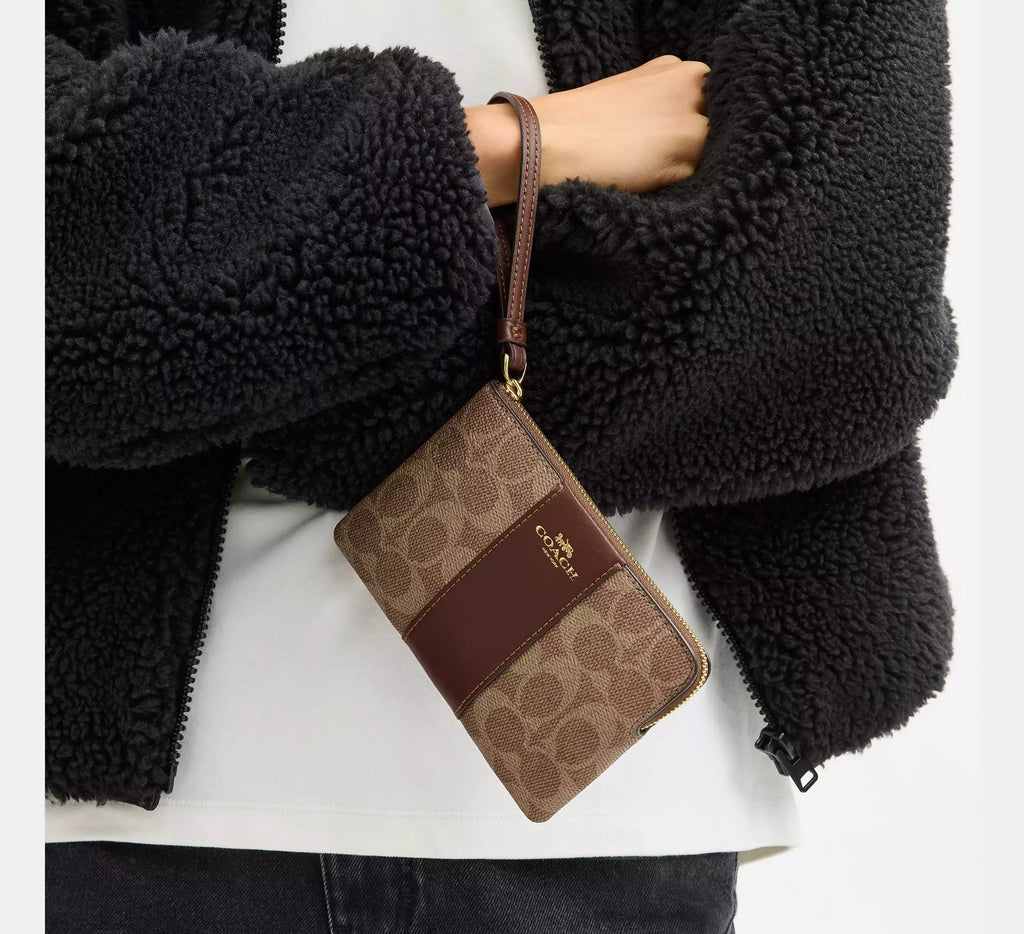 COACH Corner Zip Wristlet In Signature Canvas With Stripe